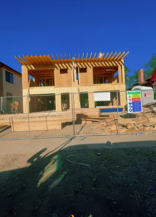 New two-storey house in wood framing on a building site